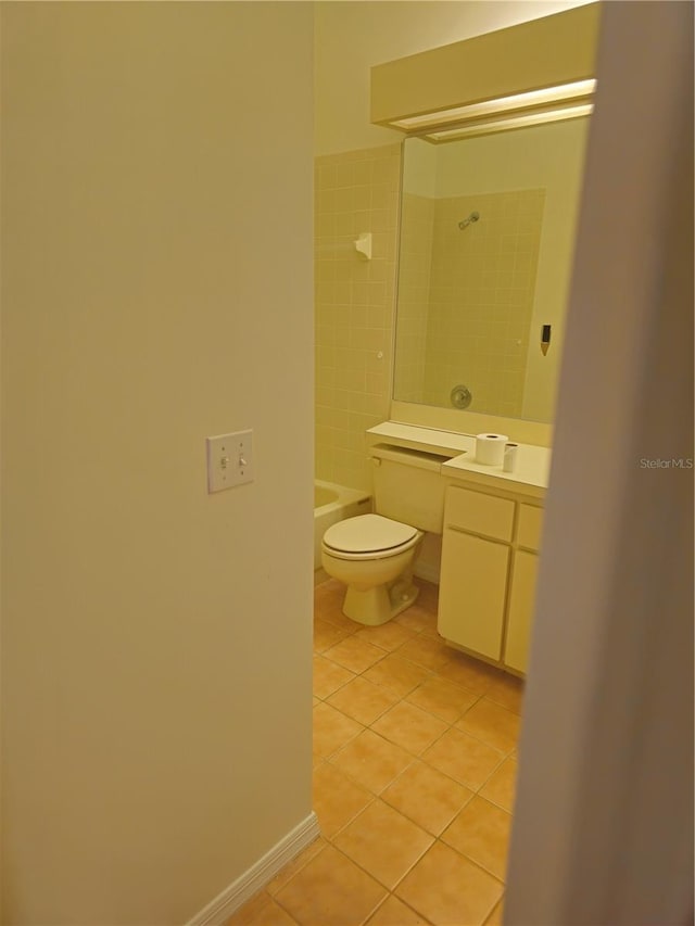 full bath featuring shower / bathtub combination, toilet, vanity, tile patterned flooring, and baseboards