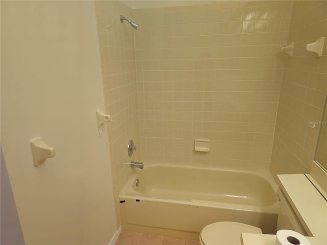 full bathroom with toilet, washtub / shower combination, and tile patterned floors