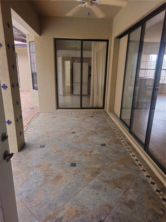 view of patio with a ceiling fan