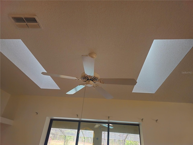 room details with a ceiling fan and visible vents