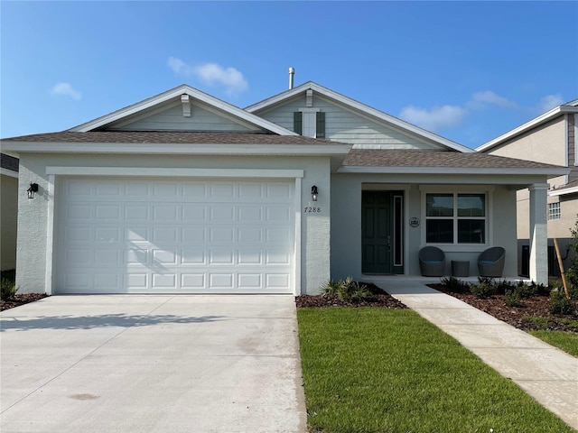 ranch-style home featuring a garage and a front lawn