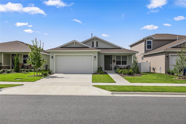 view of front facade with a garage and a front yard