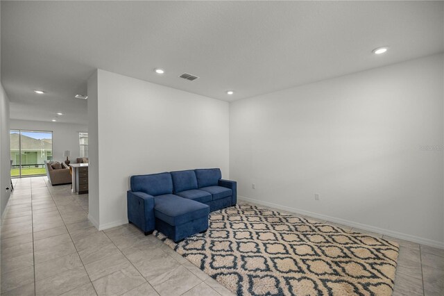 living area with light tile patterned floors