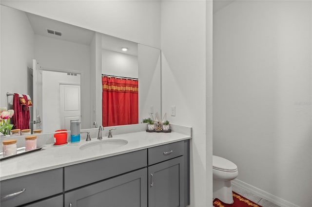 bathroom with vanity and toilet