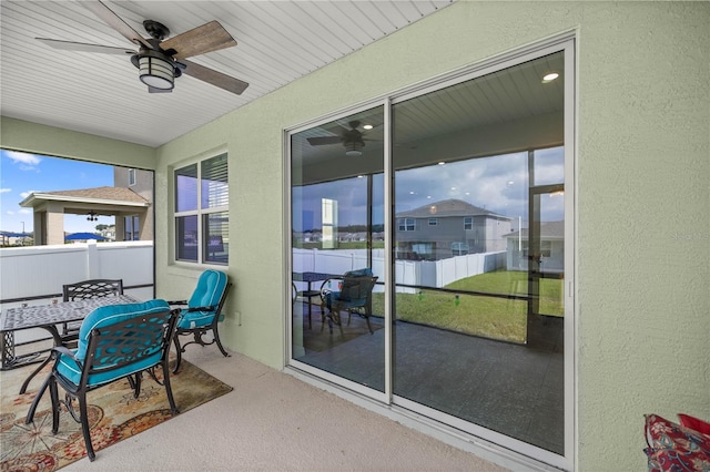 sunroom / solarium with ceiling fan