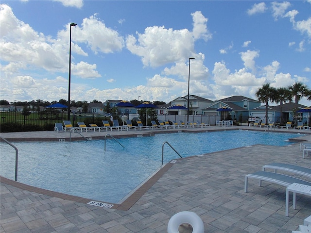 view of swimming pool with a patio