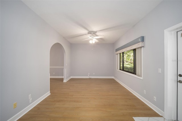 spare room with ceiling fan and light hardwood / wood-style floors