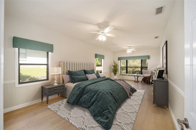 bedroom featuring light hardwood / wood-style flooring and ceiling fan