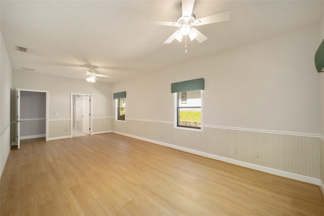 unfurnished room featuring ceiling fan and light wood-type flooring