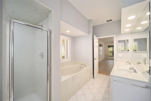 bathroom featuring vanity, hardwood / wood-style floors, and independent shower and bath