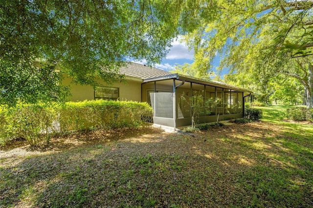 back of house with a sunroom