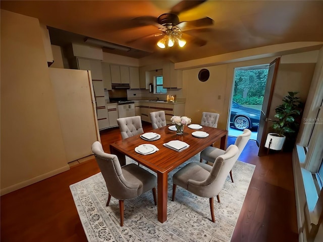 dining room with wood-type flooring, sink, and ceiling fan