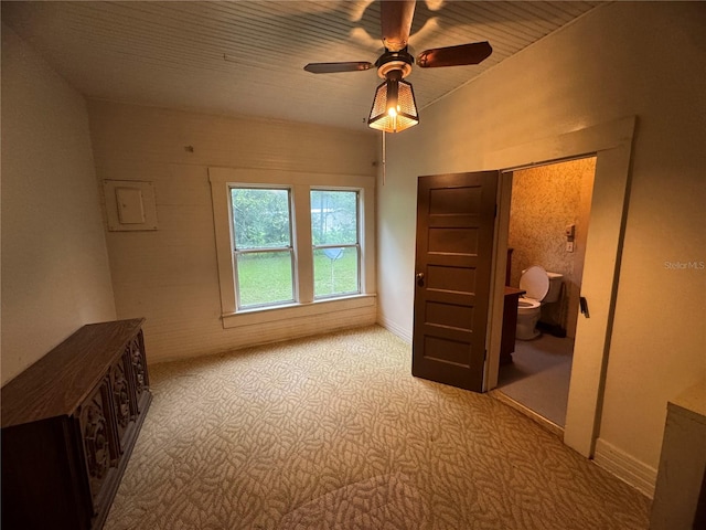 carpeted bedroom featuring ceiling fan and connected bathroom