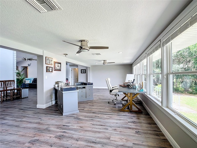 interior space with ceiling fan