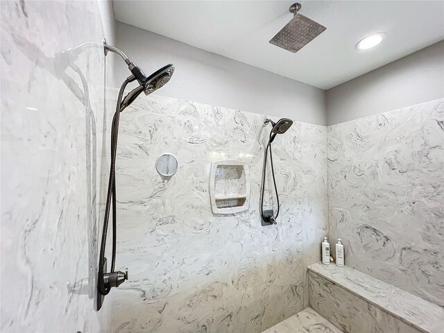 bathroom featuring a tile shower