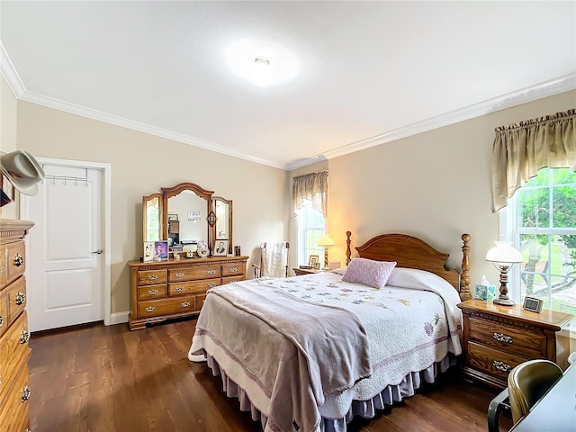 bedroom with dark hardwood / wood-style floors and crown molding