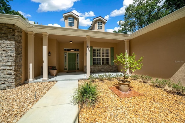 property entrance featuring covered porch