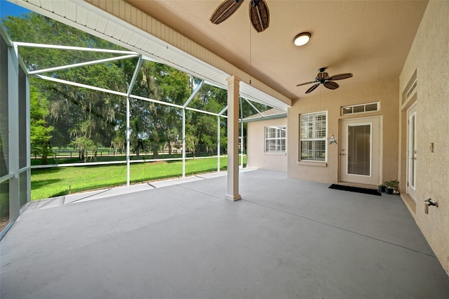 view of patio with a lanai and ceiling fan