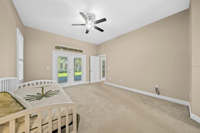 carpeted bedroom featuring french doors, ceiling fan, and access to outside