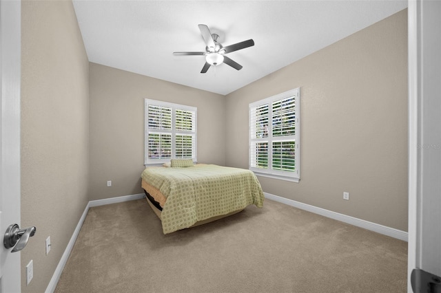 bedroom featuring ceiling fan and light colored carpet