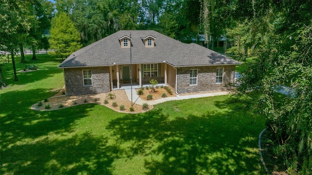 back of house with a lawn and a patio