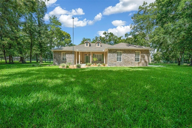 rear view of house with a yard