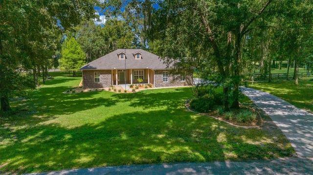 view of front of home featuring a porch and a front lawn