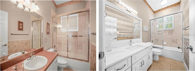 full bathroom featuring vanity, toilet, and combined bath / shower with glass door