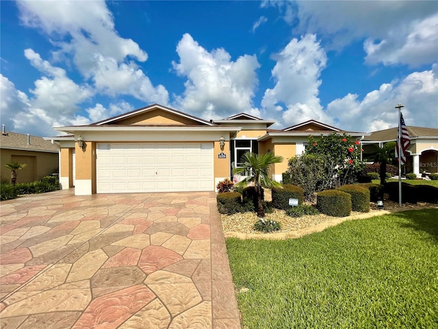 view of front of property featuring a garage and a front yard