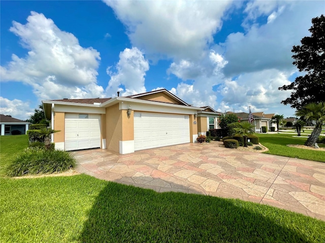 view of front facade featuring a garage and a front lawn