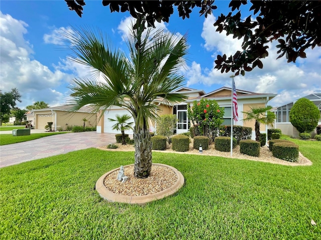 view of front facade featuring a garage and a front lawn