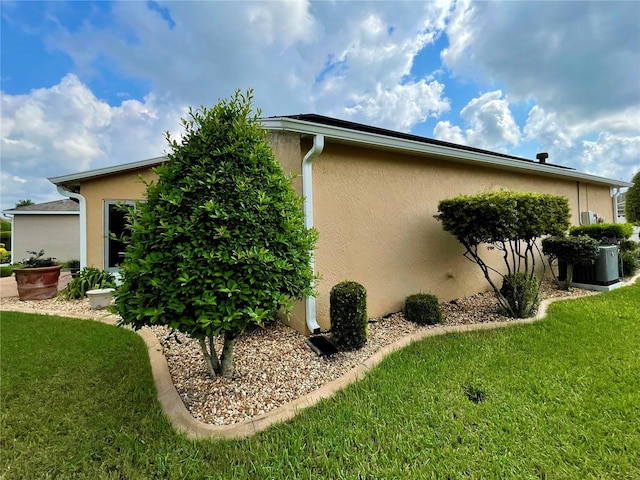 view of home's exterior with a lawn