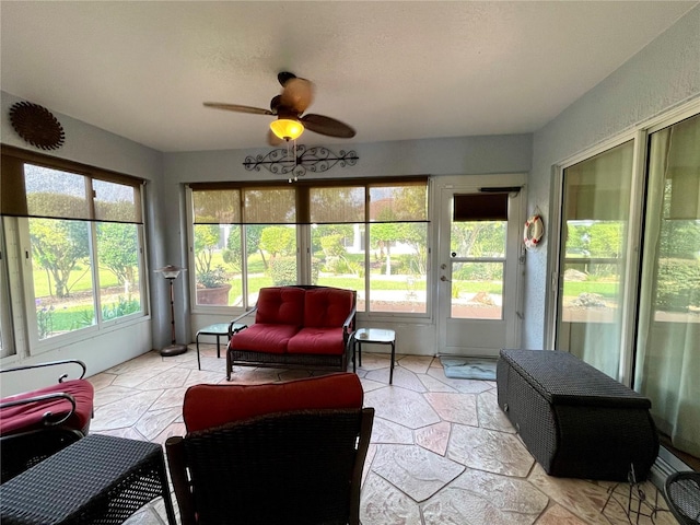 sunroom with ceiling fan