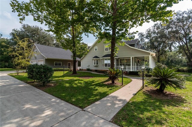 view of front of home with a porch and a front lawn