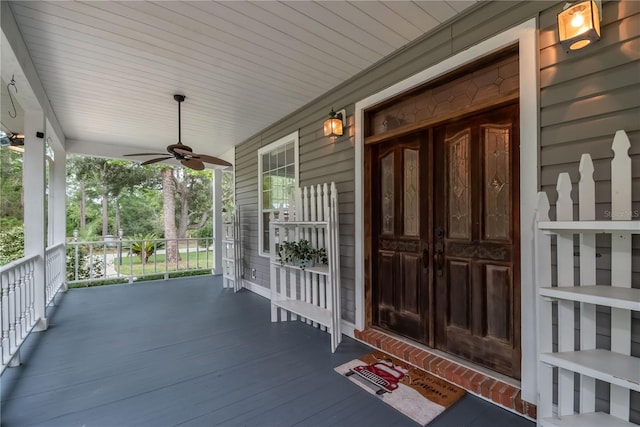 wooden deck with ceiling fan