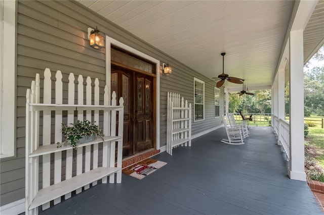 wooden deck with ceiling fan