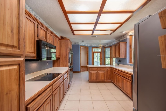 kitchen featuring ceiling fan, sink, kitchen peninsula, black appliances, and light tile patterned flooring