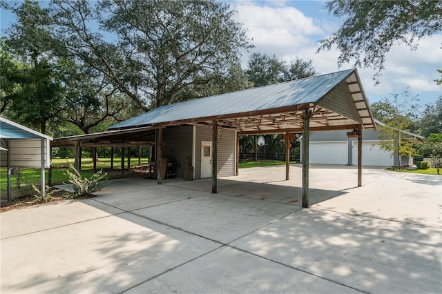 view of vehicle parking featuring a garage