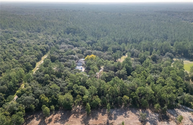 bird's eye view featuring a wooded view