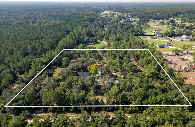 drone / aerial view with a view of trees