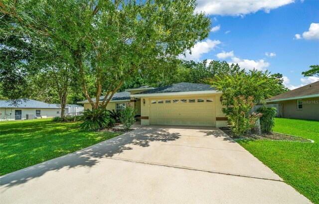 view of front facade with a garage and a front yard