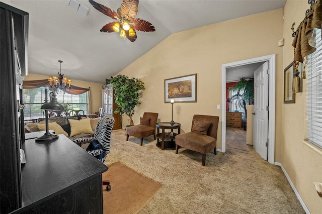 carpeted living room with ceiling fan with notable chandelier and lofted ceiling