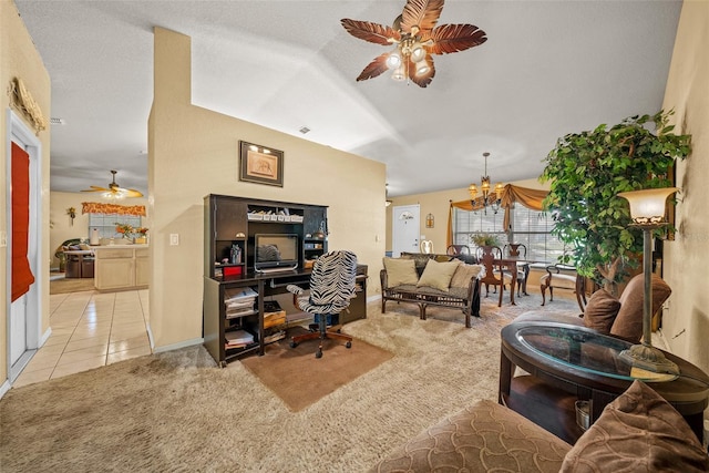 living area featuring ceiling fan with notable chandelier, light carpet, and light tile patterned floors