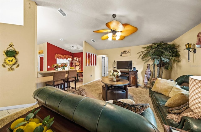 living room with a textured ceiling, vaulted ceiling, ceiling fan with notable chandelier, and carpet