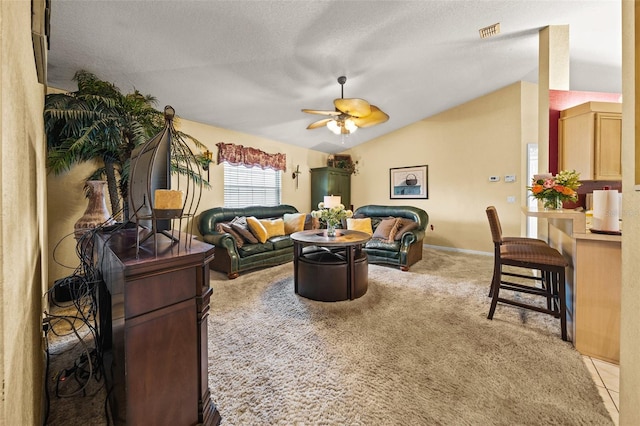 living area with lofted ceiling, visible vents, light carpet, ceiling fan, and a textured ceiling