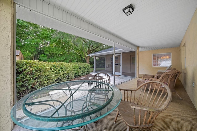 view of patio with a sunroom