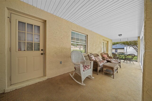 view of patio featuring covered porch and outdoor lounge area