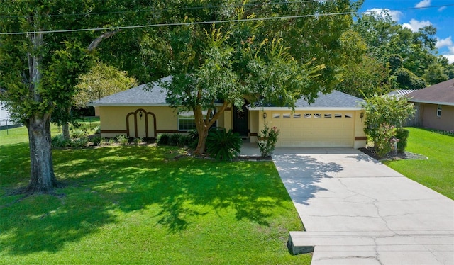 view of front of home with a garage and a front yard