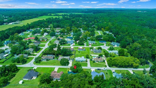 bird's eye view featuring a residential view and a wooded view