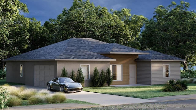 view of front of property featuring a garage and a front yard